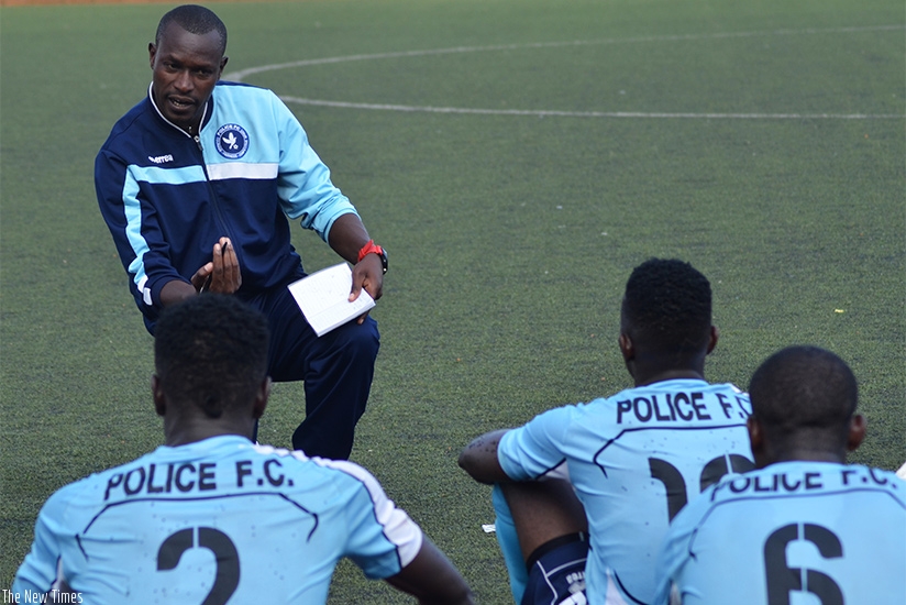 Police FC head coach Seninga gives instructions to his players at half time during a past match against Gicumbi FC. (Sam Ngendahimana)