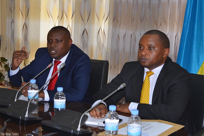 State Minister for Primary and Secondary Education Isaac Munyakazi (L) and State Minister in charge of TVET Olivier Rwamukwaya address journalists while announcing results of the 2....