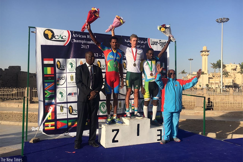 South Africa's Stefan Debod (C), Eritrea's Habton Awet (L), and Rwanda's Joseph Areruya pose with their medals at the podium yesterday. Courtesy