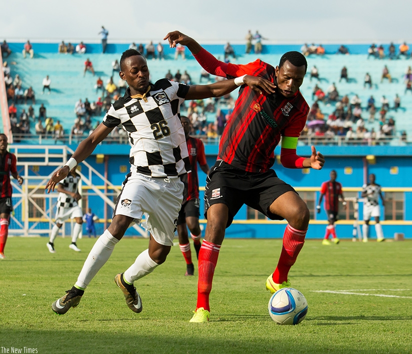 APR FC striker Bigirimana Issa (L) fights for the ball with Zanaco FC skipper Rachar Kola at Amahoro Stadium. (Photos by Timothy Kisambira)