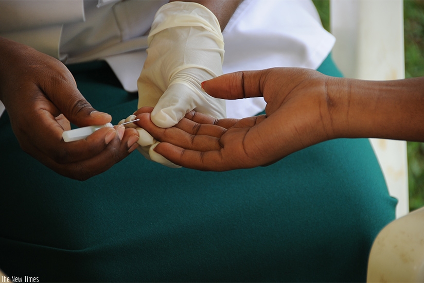 A volunteer tests for HIV at King Faisal Hospital Kigali. Self-test could soon be adopted to increase the number of people knowing their serostatus. (File)