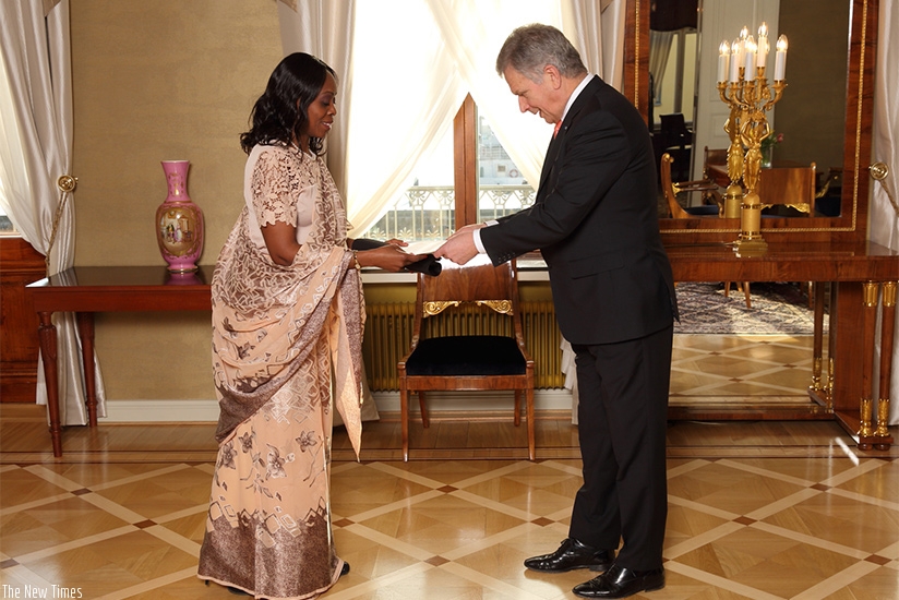 Rwandan envoy Christine Nkurikiyinka presents her credentials to President Sauli Niinisto of Finland. (Courtesy)