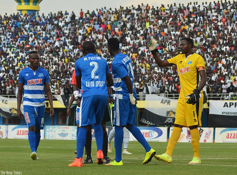 Rayon captain Ndayishimiye intervenes after one of his teammates is shown a yellow card during their league match against APR recently Sam Ngendahimana 