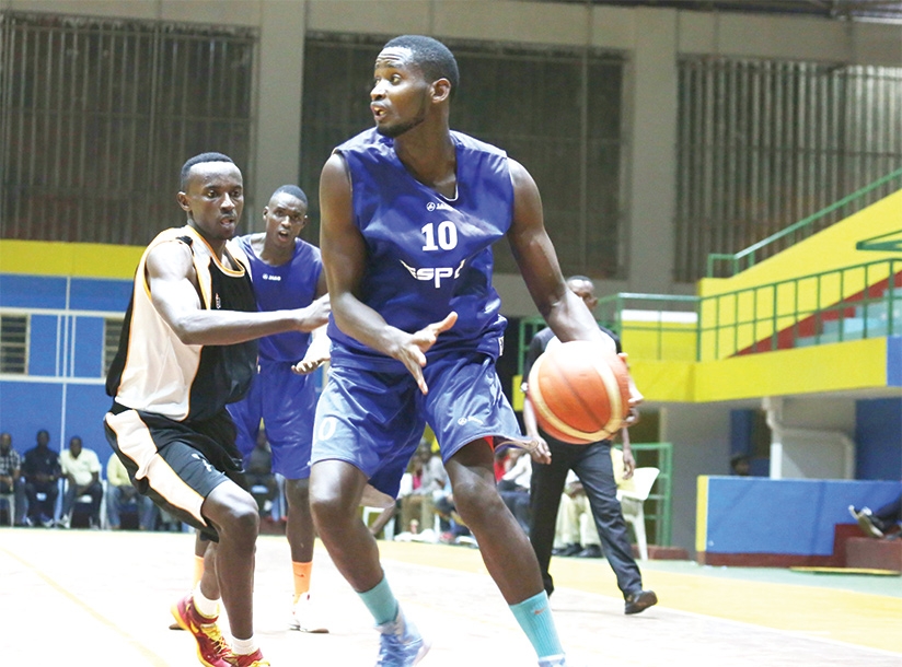 Espoir skipper Olivier Shyaka dribbles past an APR player during a recent league encounter at Amahoro indoor stadium Sam Ngendahimana