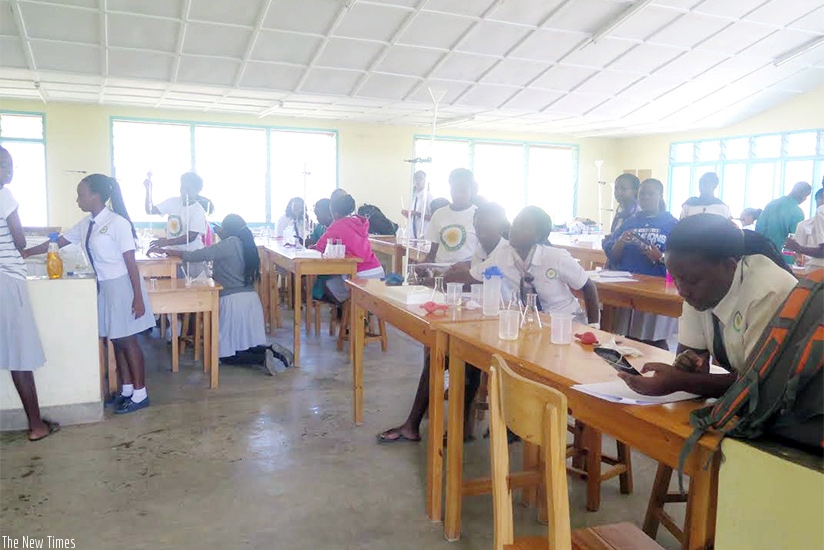 Senior Six students do a chemistry practical at Gashora Girls Academy. (File)