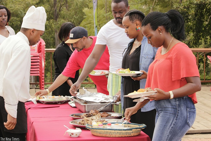 People queuing up for Mutzig Lite Barbecue at Kigali Golf Club. / Courtesy 