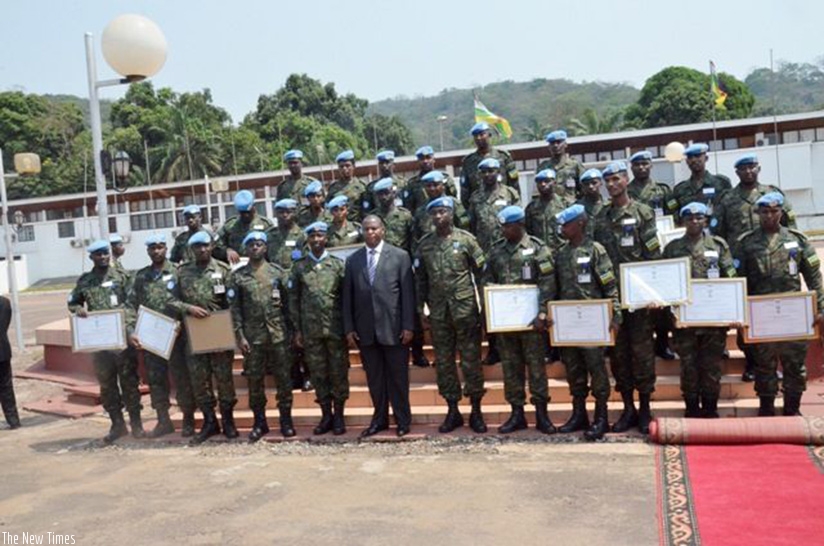 President Touadera in a group photo with the decorated RDF peacekeepers. Courtesy