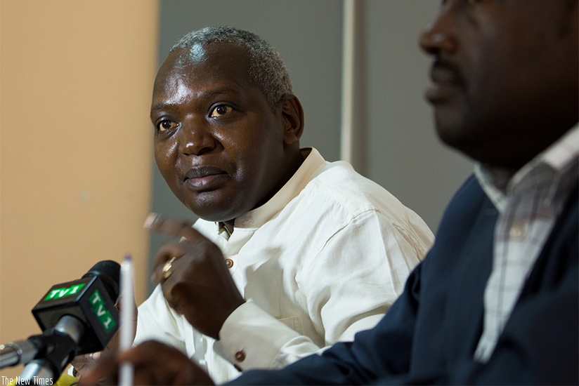 Munyamaliza (L) addresses journalists Iin Kigali yesterday. Timothy Kisambira.