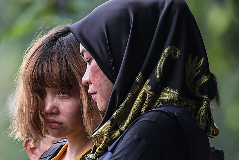Doan Thi Huong (left) and Siti Aisyah arriving at court. The pair were made to wear bulletproof vests as they left. Photograph: Mohd Rasfan/AFP/Getty Images