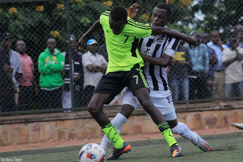 Gicumbi FC striker Seleiman Mudeyi, in action against APR FC defender  Michel Rusheshangoga, Mudeyi scored the lone goal in the 1-0 win on Wednesday.  S. Ngendahimana.