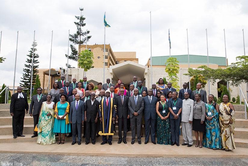 President Kagame in a group photo with Members of the East African Legislative Assembly and other officials at Parliament Building in Kigali yesterday. Village Urugwiro.