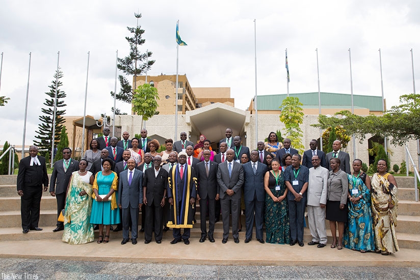 President Kagame in a group photo with Members of the East African Legislative Assembly and other officials at Parliament Building in Kigali yesterday. Village Urugwiro.