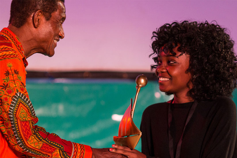 Dusabejambo receives her previous award at the Zanzibar International Film Festival in 2016. / Internet photo