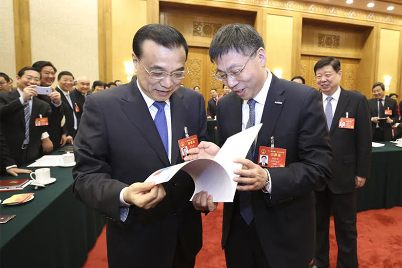 China's Premier Li Keqiang (left) and another official at the function. / Richard Ruhimbana