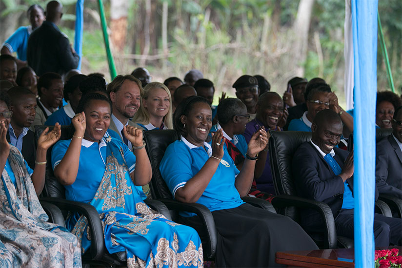 The First Lady, Mrs Jeannette Kagame, Gender and Family Promotion minister Esperance Nyirasafari (left) and the Mayor of Nyabihu District, Theoneste Uwanzwenuwe (R), cheer a perfor....