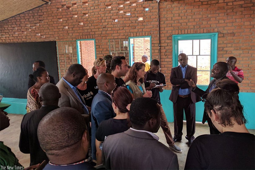 Unicef,  Imbuto Foundation and AerLingus representatives visit the Early Childhood Development Centre in Muhororo, Ngororero District on Wednesday. Diane Mushimiyimana.