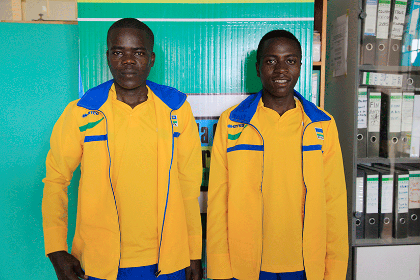 Fly cyclist Jean Eric Habimana (L) and Didier Munyaneza of Club Benediction (R) pose for a photo before heading to South Africa yesterday (Sam Ngendahimana)