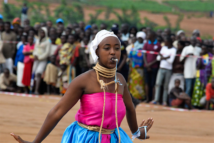 A Burundian refugee performs a folk dance during the event. / Courtesy