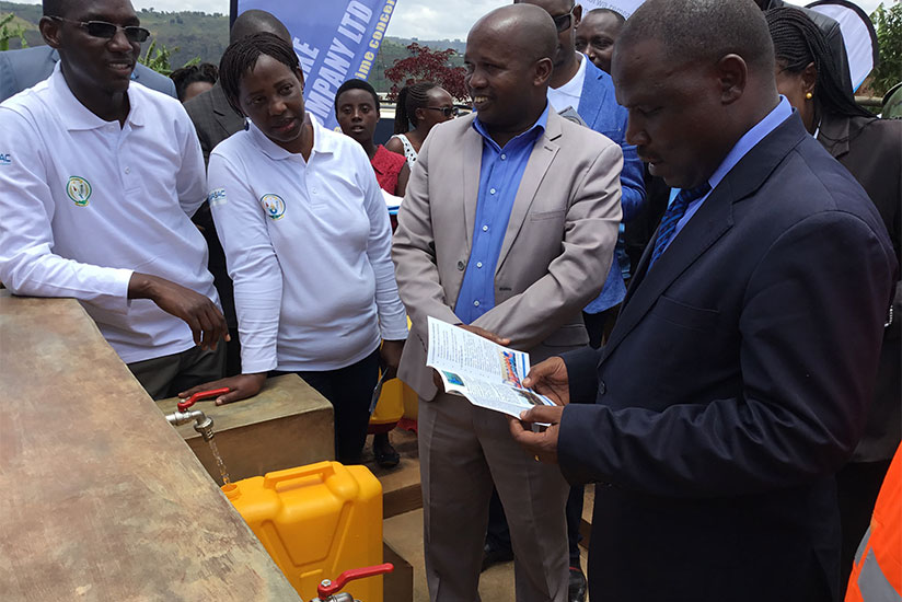 L-R: Emmanuel Kayiranga, the mayor of Rulindo District; Perpetue Kamuyumbo, from Water for People; Cyprien Sebikwekwe, the managing director of Ayateke Star Company; and Jean Claud....