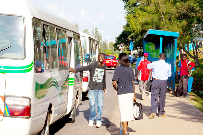 A passenger boards a minibus at Kimihurura bus stop. / File