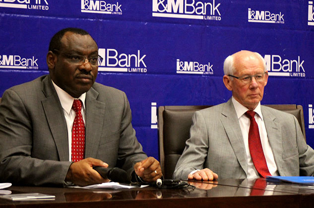 Finance Minister Claver Gatete and I&M Bank Rwandau2019s board chairman Bill Irwin give explanations at the launch of the sale of the Stateu2019s shares in the bank on 14th February.