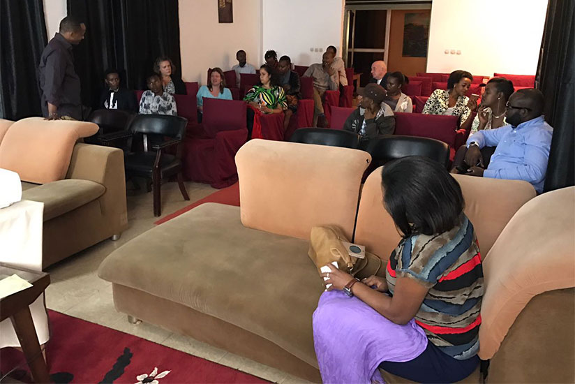 The audience at Wednesdayu2019s film screening engage in a question-and-answer session. Left: Eric Kabera, the founder and director of Kwetu Film Festival. Courtesy photos