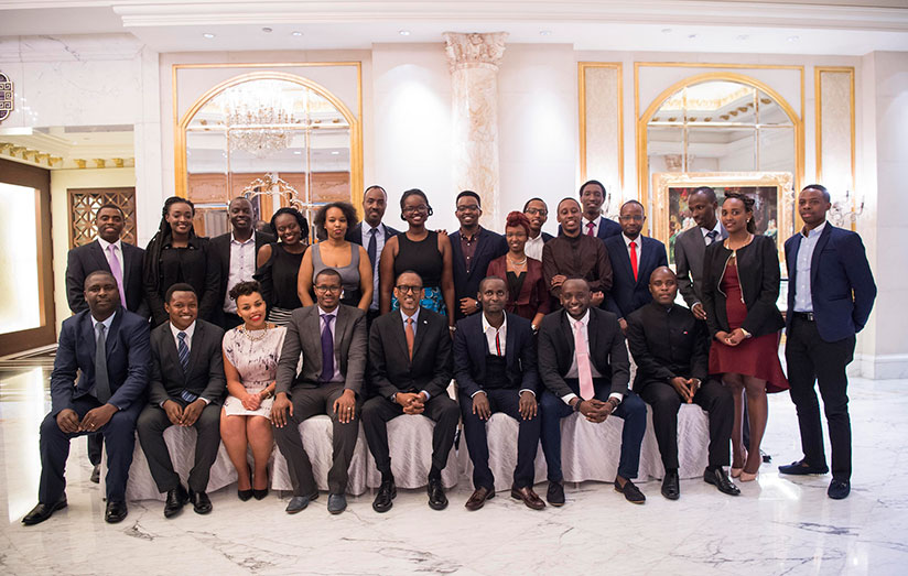 President Kagame with Rwandan students in China. In the background is Rwanda's Ambassador to China, Charles Kayonga. As part of his meeting with students, Kagame also met with memb....