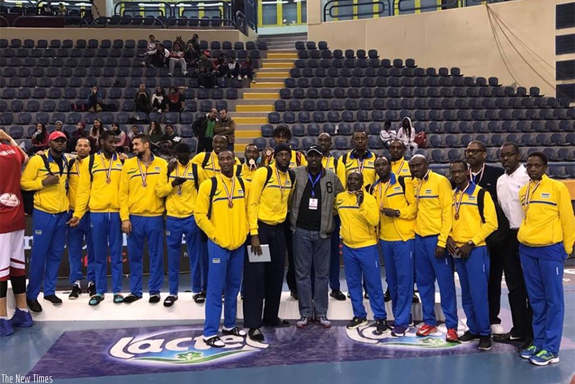 Rwannda national basketball team pose with their bronze medals after defeating Burundi 89-75 in the third place play-off on Saturday. Courtsey.