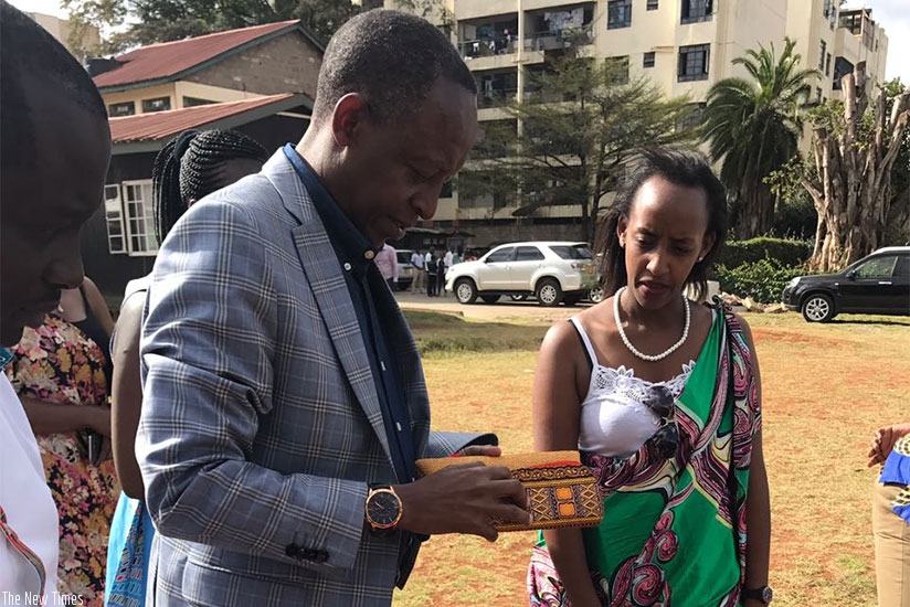 Amb. Kimonyo inspects some of the products exhibited during the fete. Courtesy.