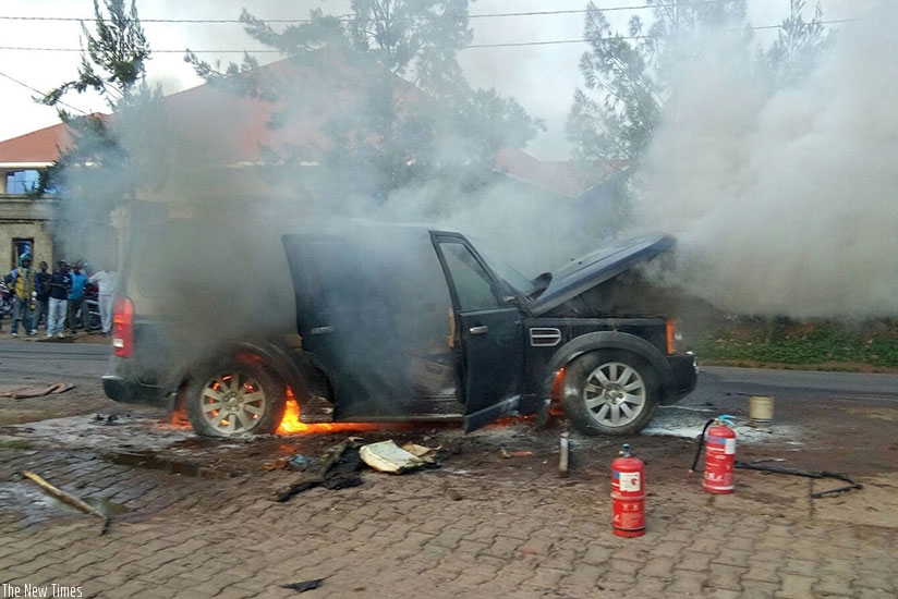 A vehicle burns in a Kigali suburb. Some insurers find difficulty in paying compensation because they sell premiums at low prices, weakening their financial positions. / File.  