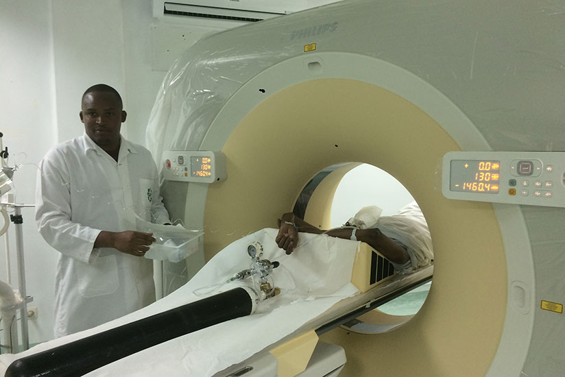 A medic uses the new 128 Multi slice CT Scan on a patient at the hospital, yesterday. / Hudson Kuteesa
