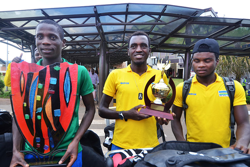 L-R: Jean Bosco Nsengimana, who won the king of the mountains award; Valens Ndayisenga, the best young rider, and Bonaventure Uwizeyimana on arrival at Kigali International Airport. / File