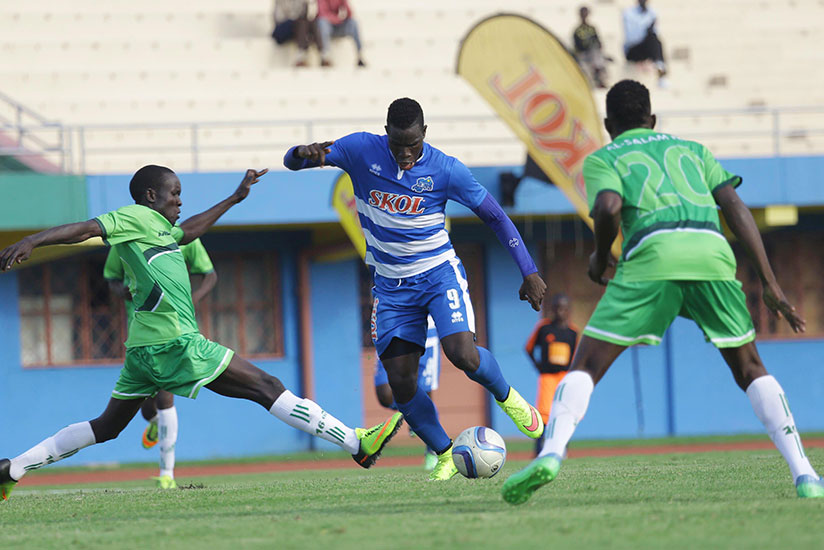 Rayon's striker Moussa Camara tries to dribble past South Sudan's Al-Wau Salaam players during the CAF Confederation Cup first round second-leg match at Amahoro Stadium. The Rwanda....