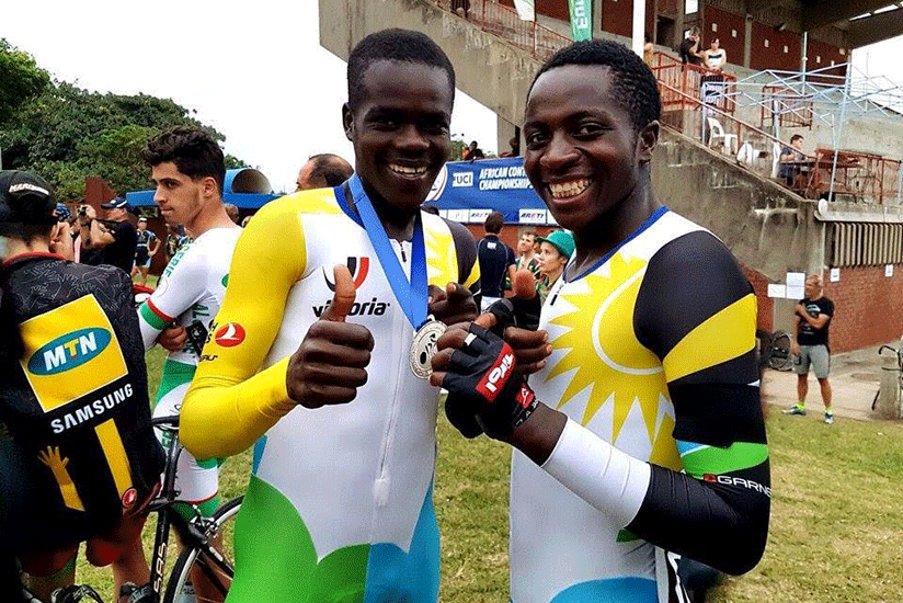 Habimana (left) and his compatriot Munyaneza after the former won silver in the junior men scratch on Tuesday on Rwanda's debut in Track Cycling. Courtsey