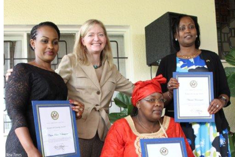 Amb. Barks-Ruggles (2nd L) pose for a group photo with the winners on Wednesday. Courtesy. 