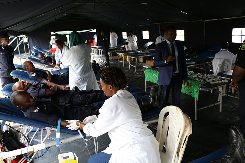 Police officers donating blood. / Courtesy