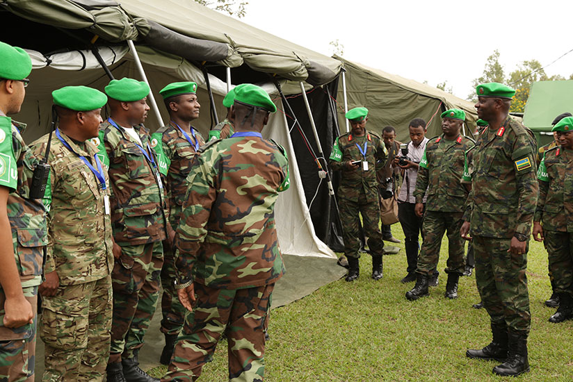 Maj Gen Jacques Musemakweli, Army Chief of Staff of the Rwanda Defence Forces (RDF), inspects the Angolan Contingent's base at the opening of the 3rd Command Post Exercise (CPX) of....