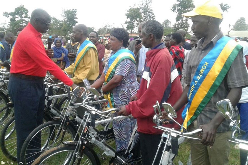 Minister Busingye rewards Abunzi with bicyles in Gatsibo District. Kelly Rwamapera. 