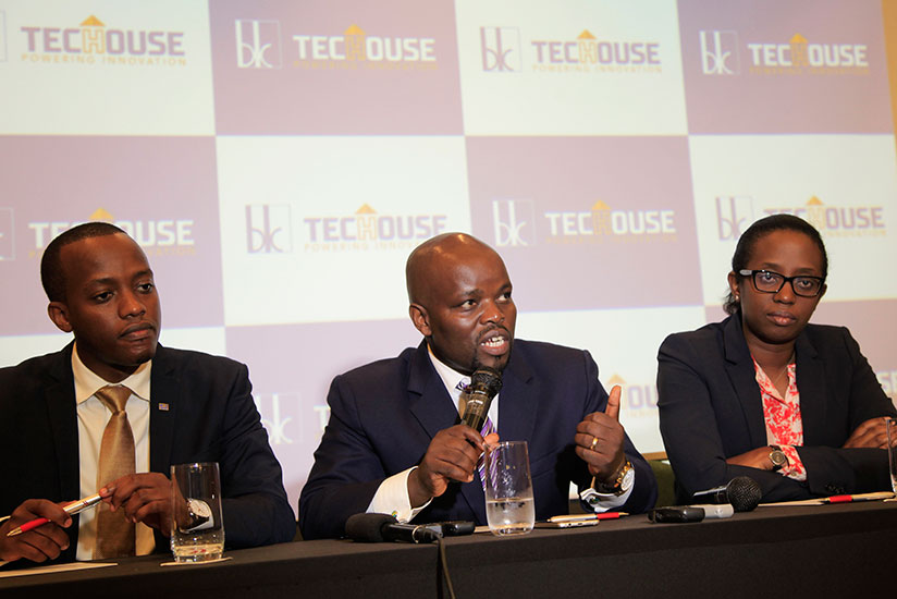 Minister for Youth and ICT responds to media as Bank of Kigali CEO Diane Karusisi and Regis Rugemanshuro look on during press conference. / Sam Ngendahimana