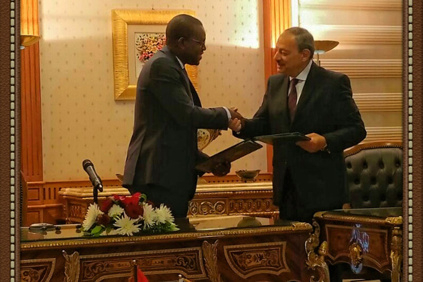 Mutangana (L) shakes hands with  his Egyptian counterpart Nabeel Ahmed Sadek after the two signed the Memorandum of Understanding in Cairo, on Thursday. Courtesy. 