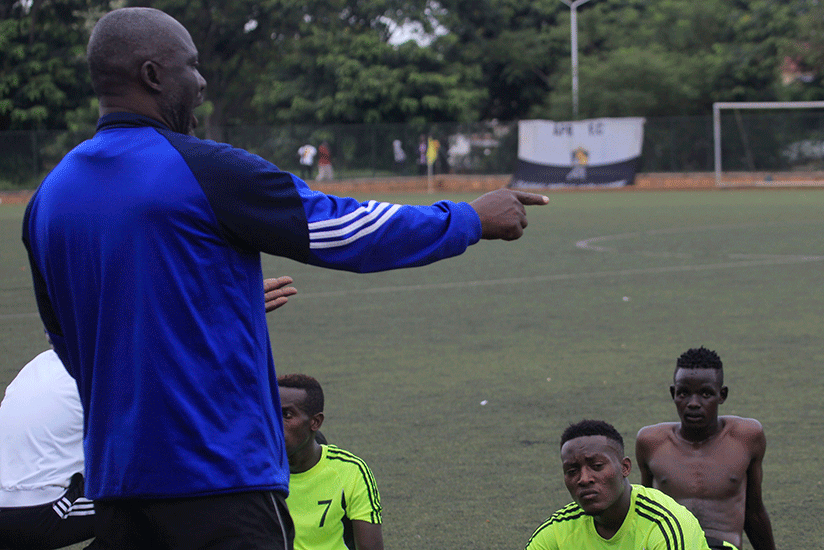 Gicumbi FC coach Okoko talking to his players during a previous match. Rashid Mutebi (#9), scored against Marines in the 2-1 win on Saturday. S. Ngendahimana