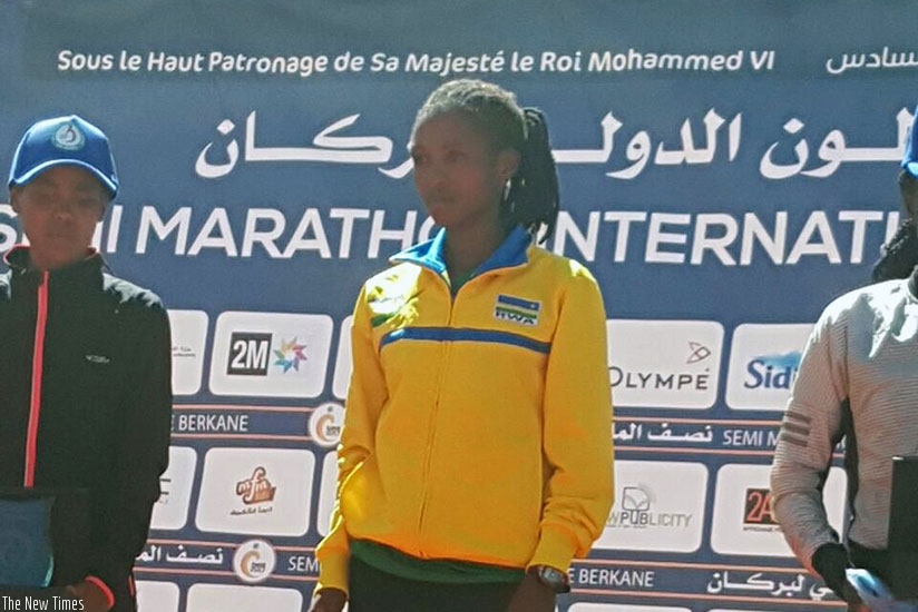 Nyirarukundo awaits her  gold medal after winning this yearu2019s Berkane International Half Marathon in Morocco on Sunday. Courtesy.