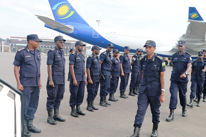 ACP Rangira leads the officers as they prepare for departure at Kigali International Airport. (Courtesy)