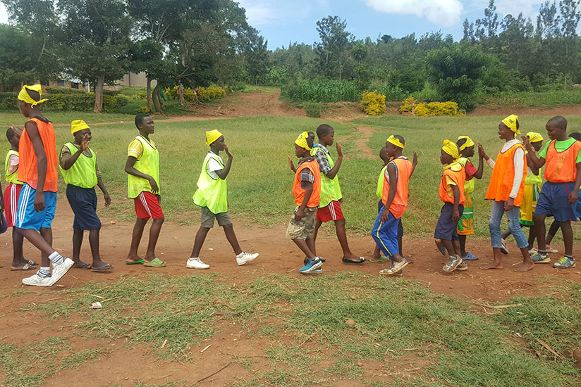Pupils of GS Mwendo in Nyarugenge, Kigali, participate in a football tournament organised to promote equality of rights .  rn(All photos by Francis Byaruhanga)
