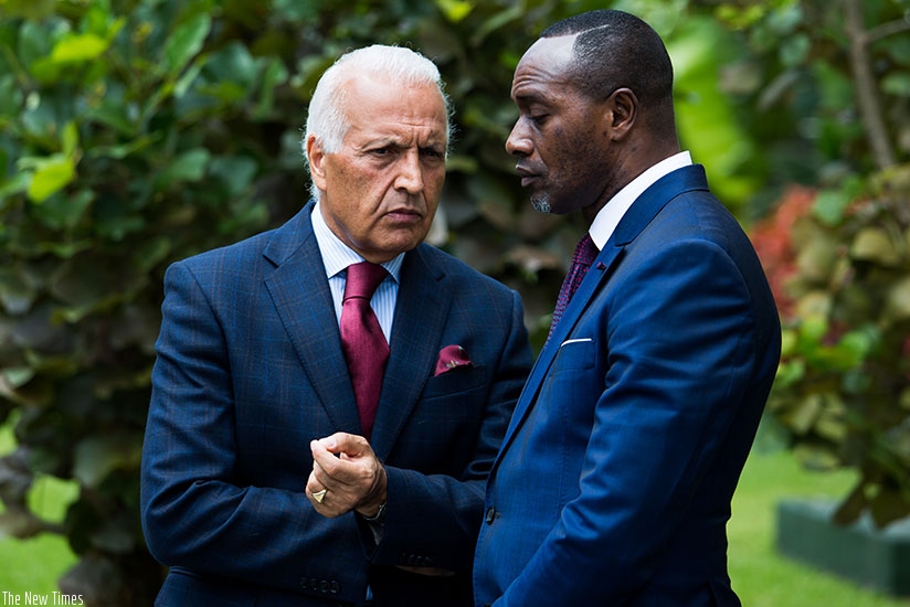 UNHCR envoys Saber and Kouame chat during the meeting in Kigali. (Timothy Kisambira)