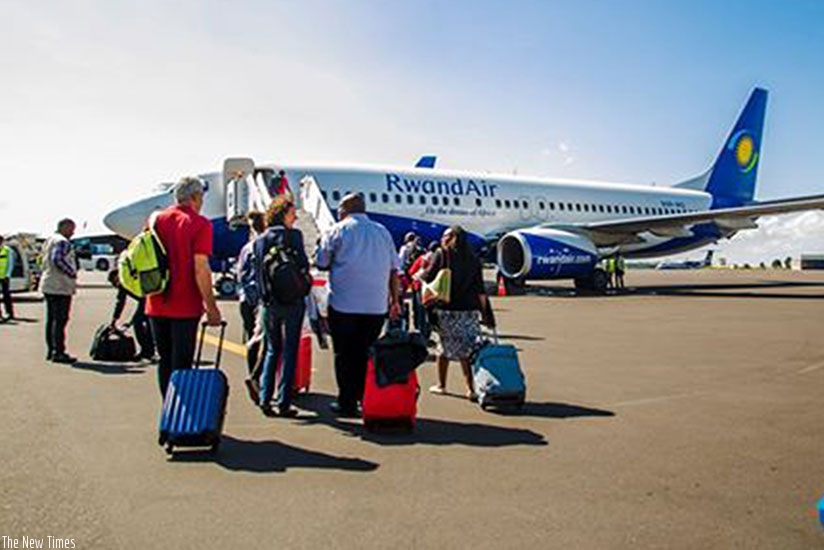 Harare-bound passengers board RwandAir's  Kalisimbi  yesterday. The airline will ply the route four times a week via Lusaka, Zambia. (Courtesy)