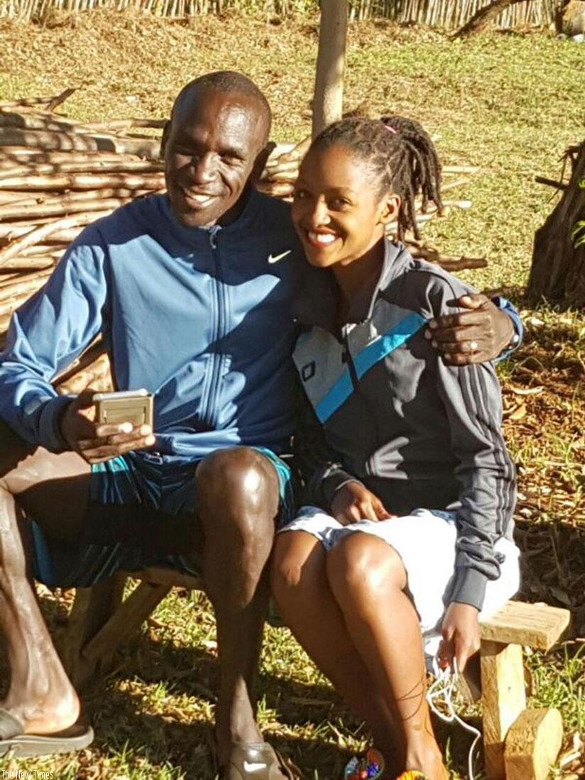 Nyirarukundo (R) poses with Kenya's 2016 Rio Olympic Games marathon gold medalist Eliud Kipchoge Kaptag at a training camp in Eldoret, Kenya. (Courtesy)