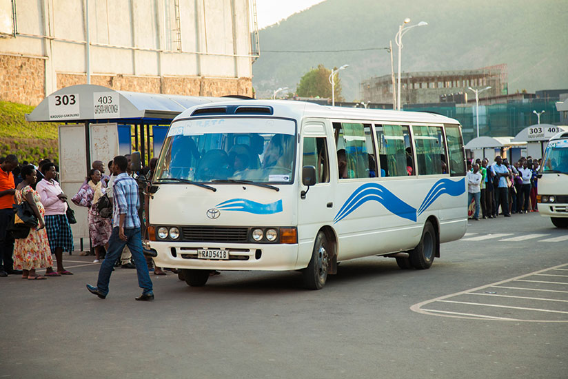 Passengers board a Nyamirambo-bound bus in Kigali. Transporters who have not yet installed speed governors as required by law could soon be barred from operations by RURA. / Nadege Imbabazi