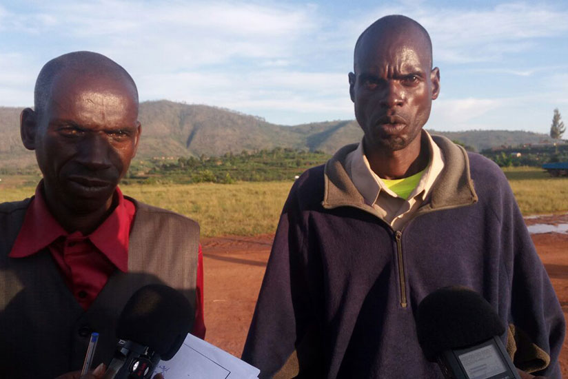 The two men, Ndorande (L) and Hakizimana (R), stood side by side in front of locals and announced they had decided to move on. / Remy Niyingize