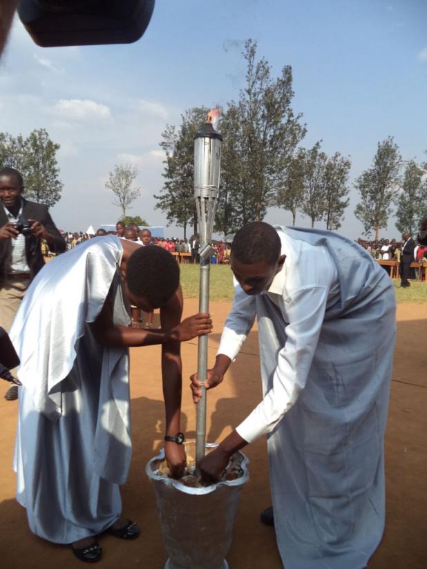 Youth position the Remembrance Flame in Mugina, Huye District, last year. / File